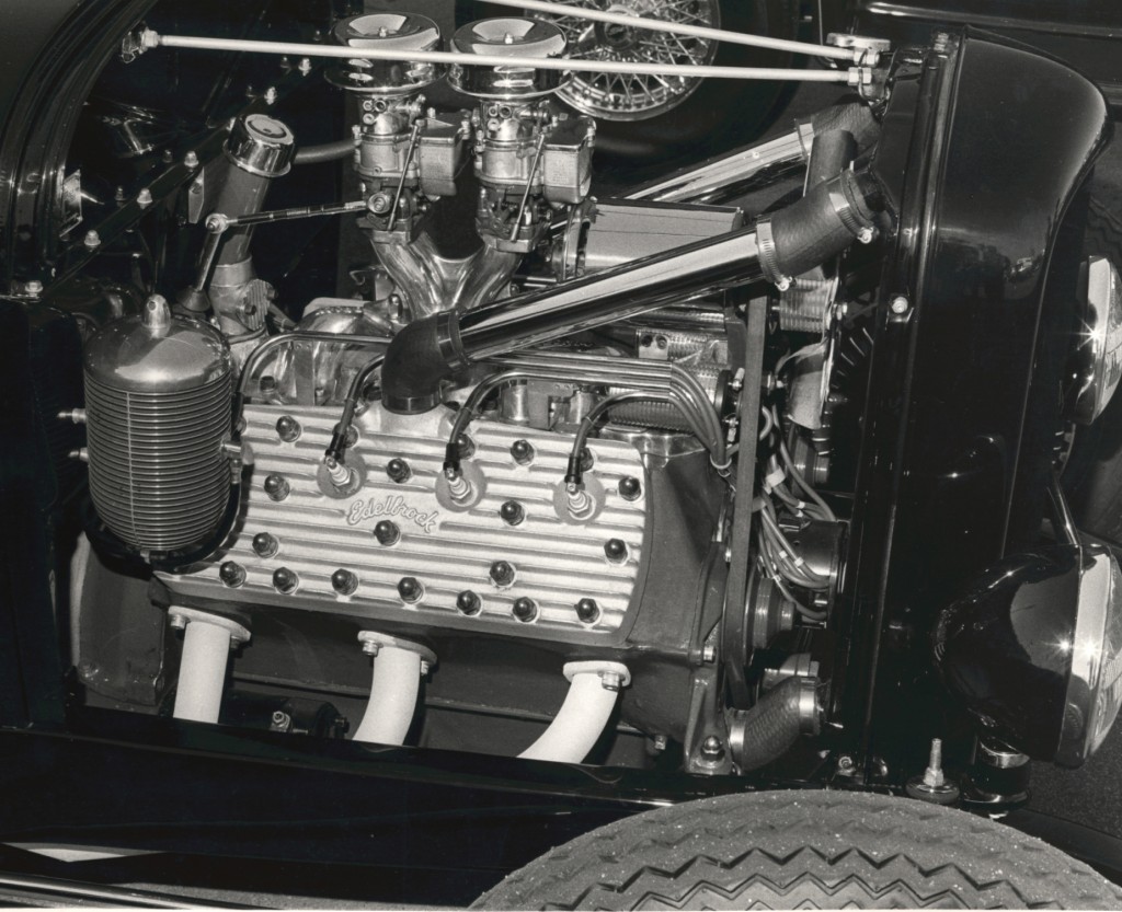 vintage photo of edelbrock parts on a flathead ford v8 in a hotrod