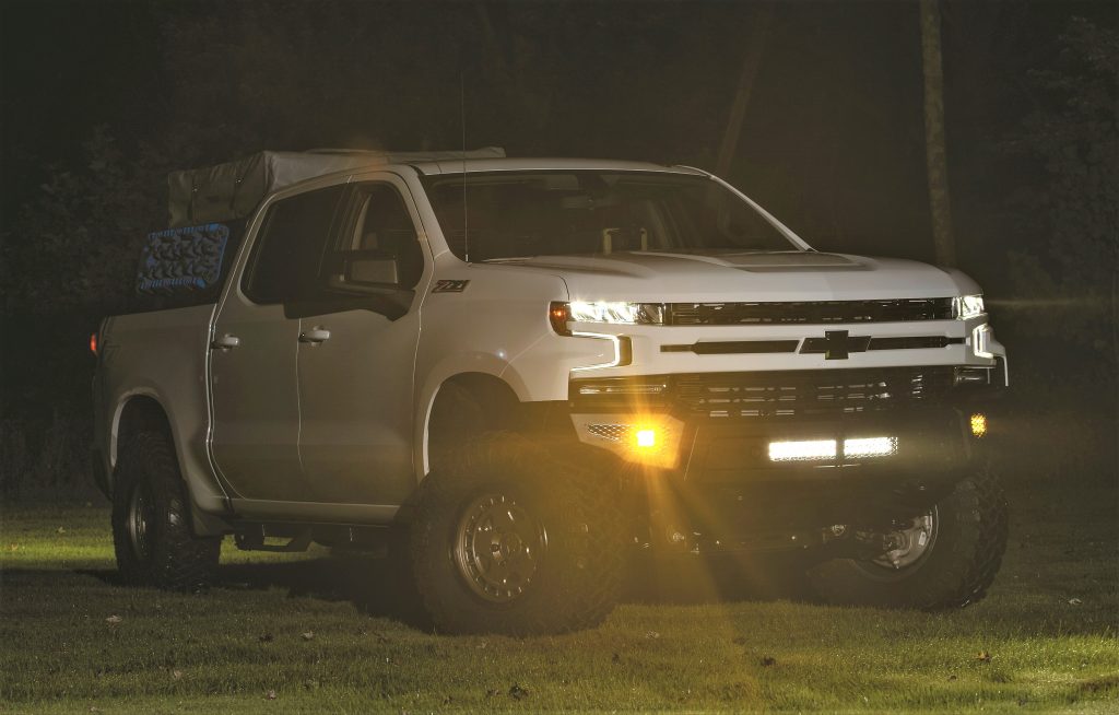 night view of a white chevy Silverado truck off road overlanding rig'