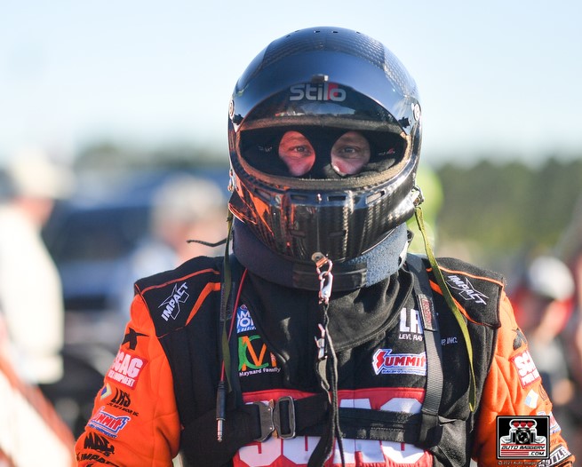 tim wilkerson racing funny car driver in stilo helmet and simpson neck restraint