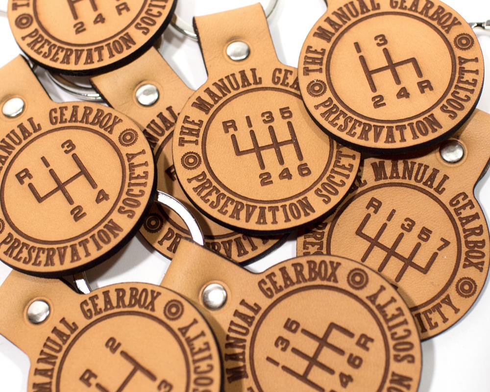 Save The Stick: New Leather Keychains From The Manual Gearbox Preservation Society Are In The Shop