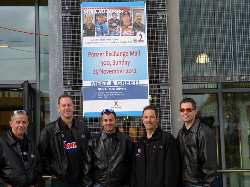 NHRA Drag Racers pose for a photo near military PX