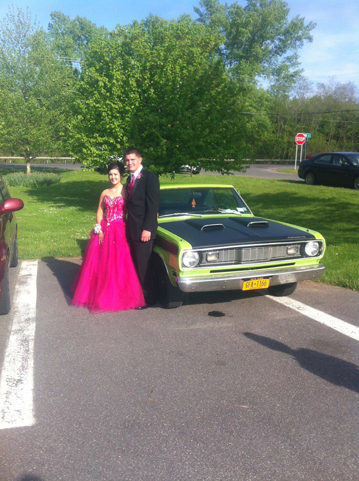 1970 Plymouth Duster with prom couple