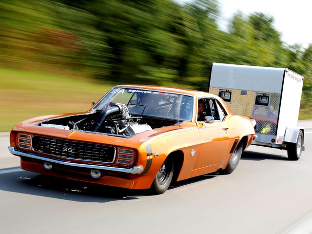 1969 camaro drag car pulling its own race trailer