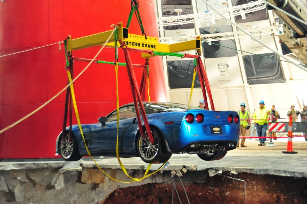 c6 corvette being removed from sinkhole on harness