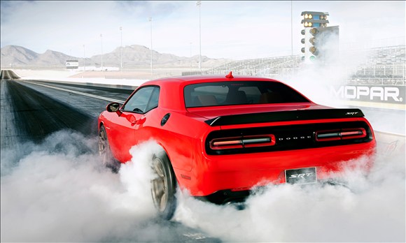 2015 dodge srt challenger hellcat doing a burnout at track