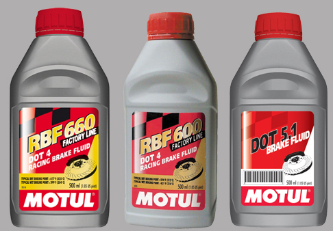 three motul brake fluid bottles