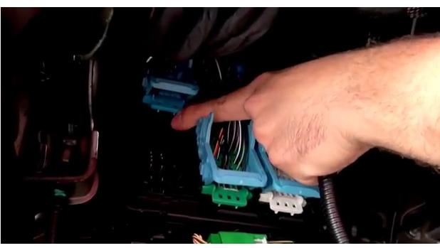 man pointing to trailer brake controller wiring harness