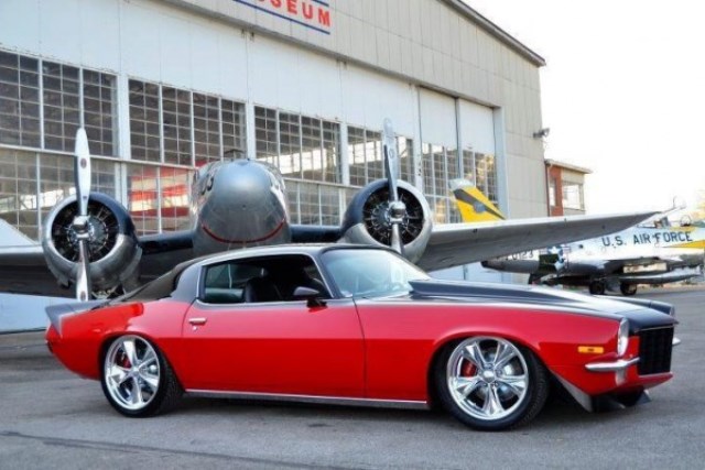 Chevy RS Camaro near a military airport hangar