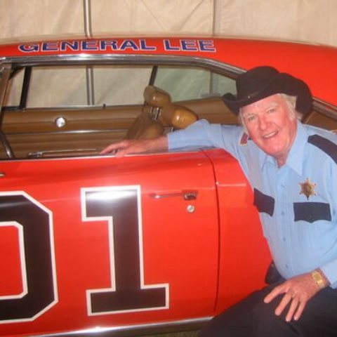 james best poses with 1969 dodge charger, general lee