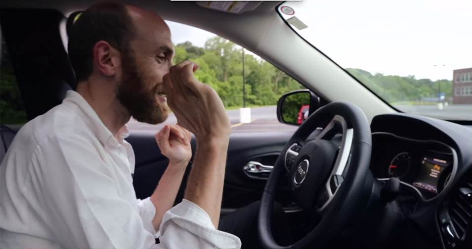 man using auto-assist to parallel park his car