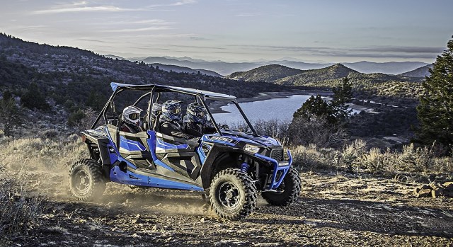 Polaris RZR racing on mountain trail