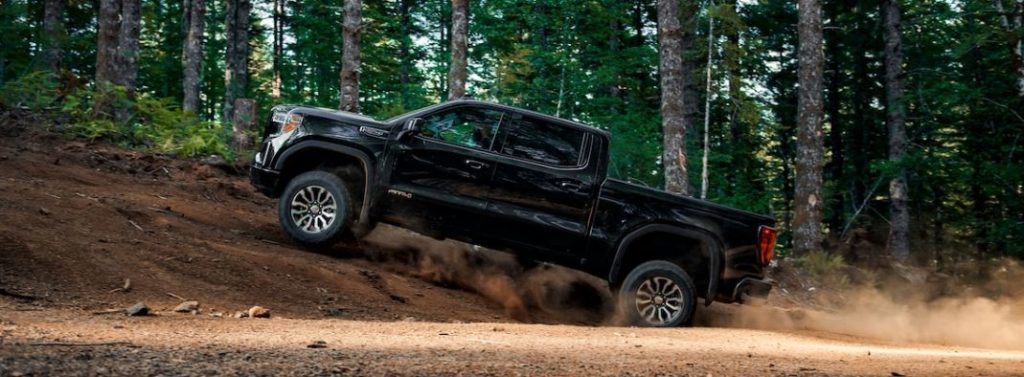 gmc sierra pickup climbing small hill