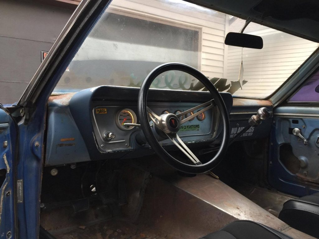 custom made gauge panel installed in an old hot rod car