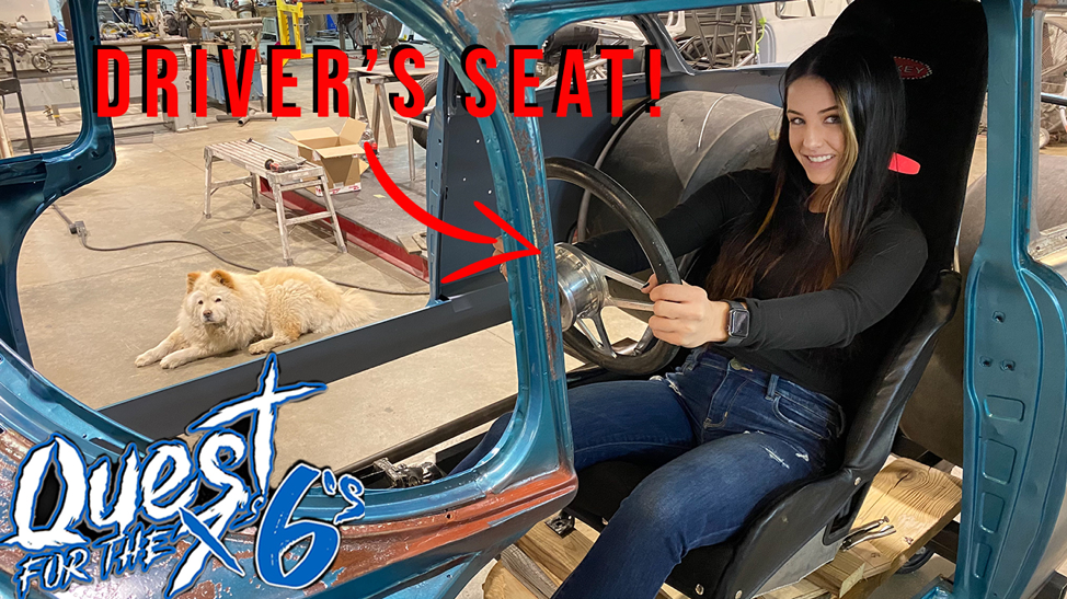 alex taylor sitting in mockup cockpit of a 1955 chevy bel air dragster