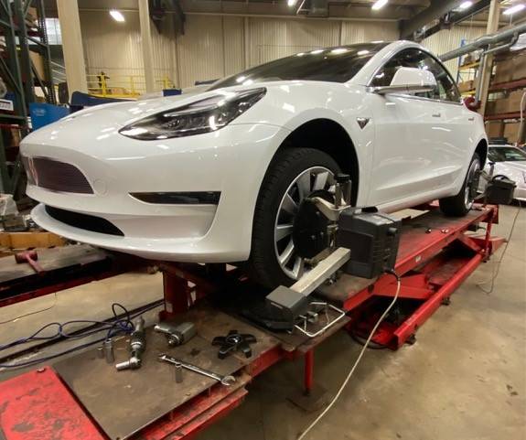 tesla model 3 performance on an alignment rack