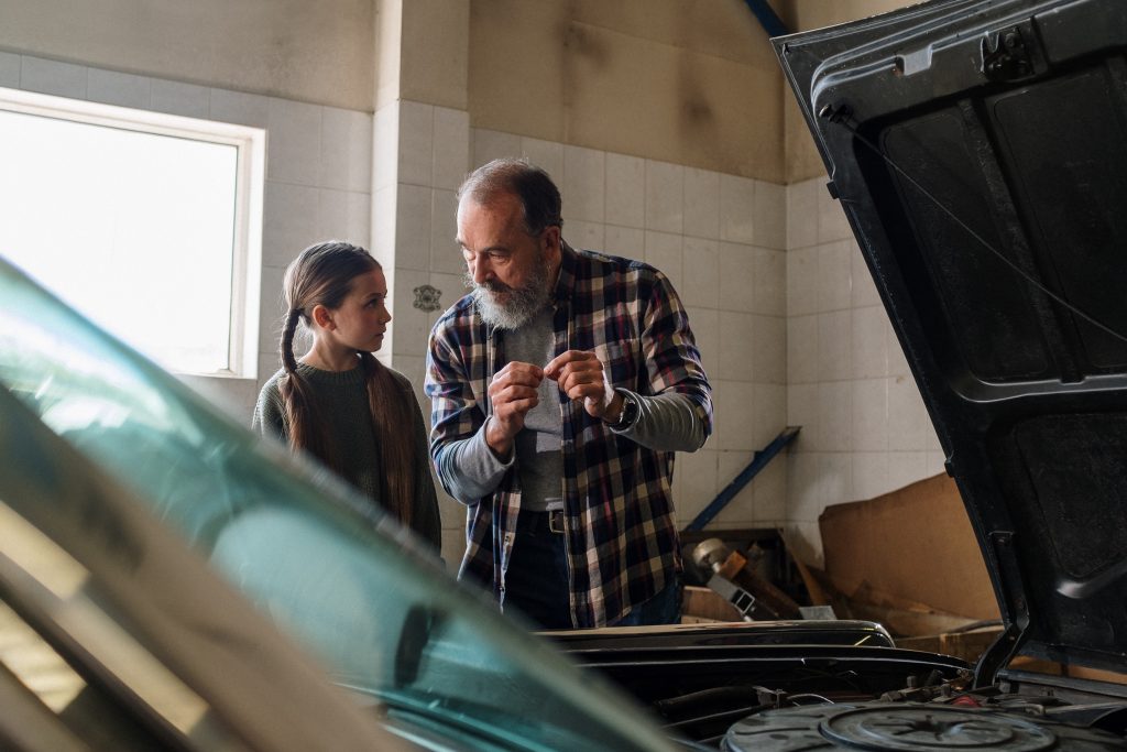 Father and daughter in the garage