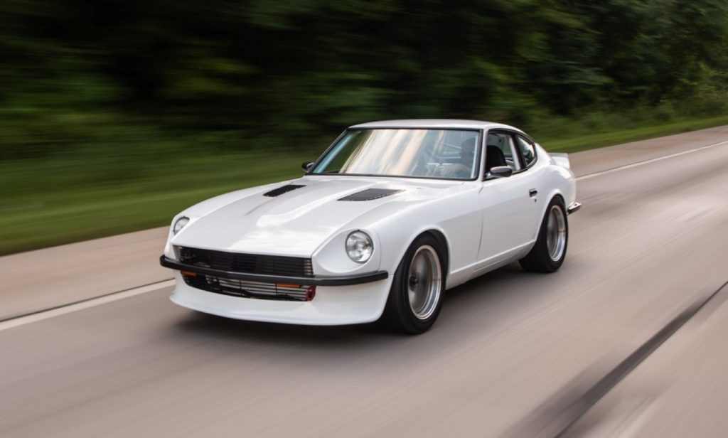 a custom 1973 datsun 240z with GM LS Engine Swap,custom 1973 datsun 240z with GM LS Engine Swap, driving along a wooded road