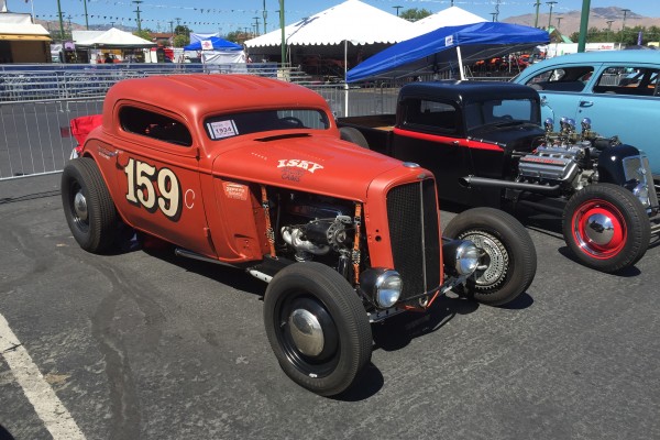 2 hot rods at a car show