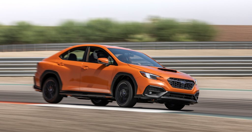 2022 subaru wrx lifting a wheel during high speed run at race track