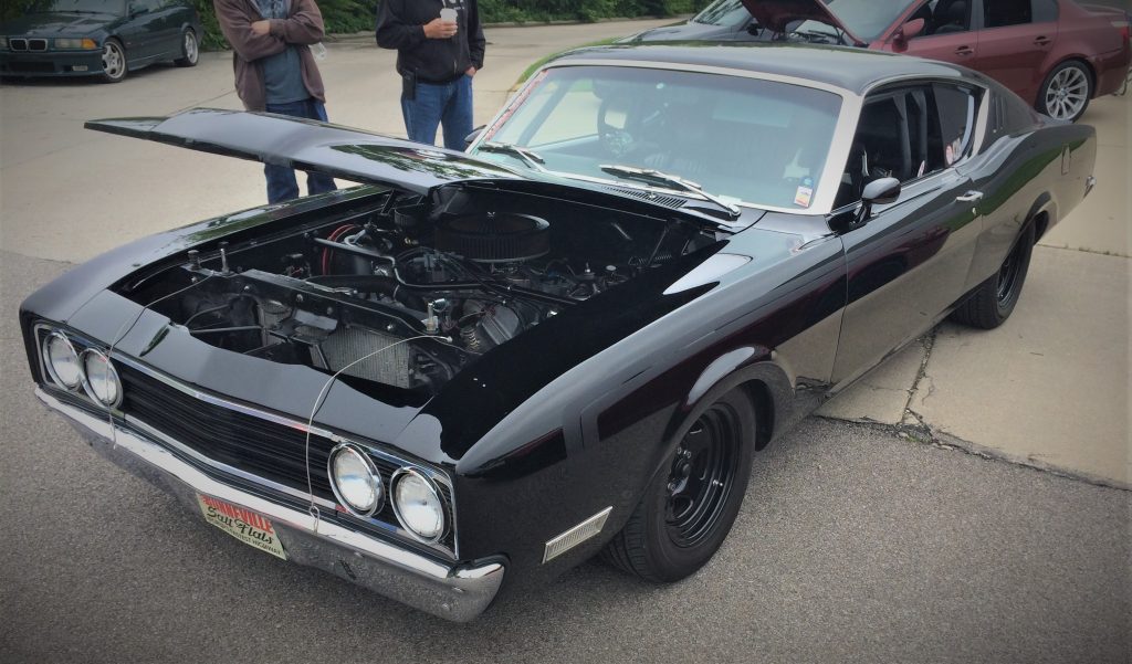 front quarter shot of a black mercury cyclone spoiler 2 land speed record car