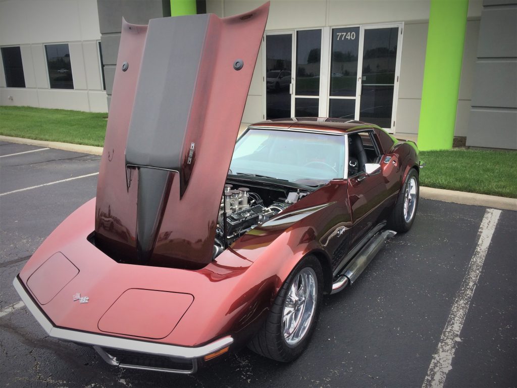 hood popped open on front of a custom 1971 chevy corvette stingray