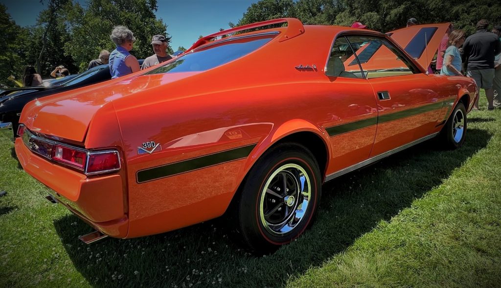 orange amc javelin 390 at a car show