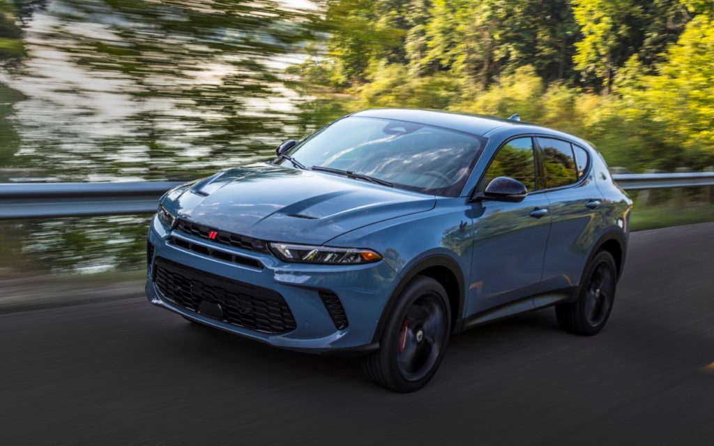 2023 Dodge Hornet GT driving on wooded road, front