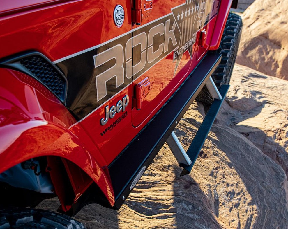 Rock Slide Engineering Retractable Step Sliders installed on a jeep wrangler