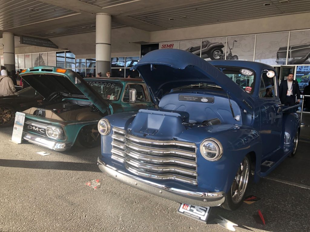row of vintage chevy and gmc trucks at SEMA 2022