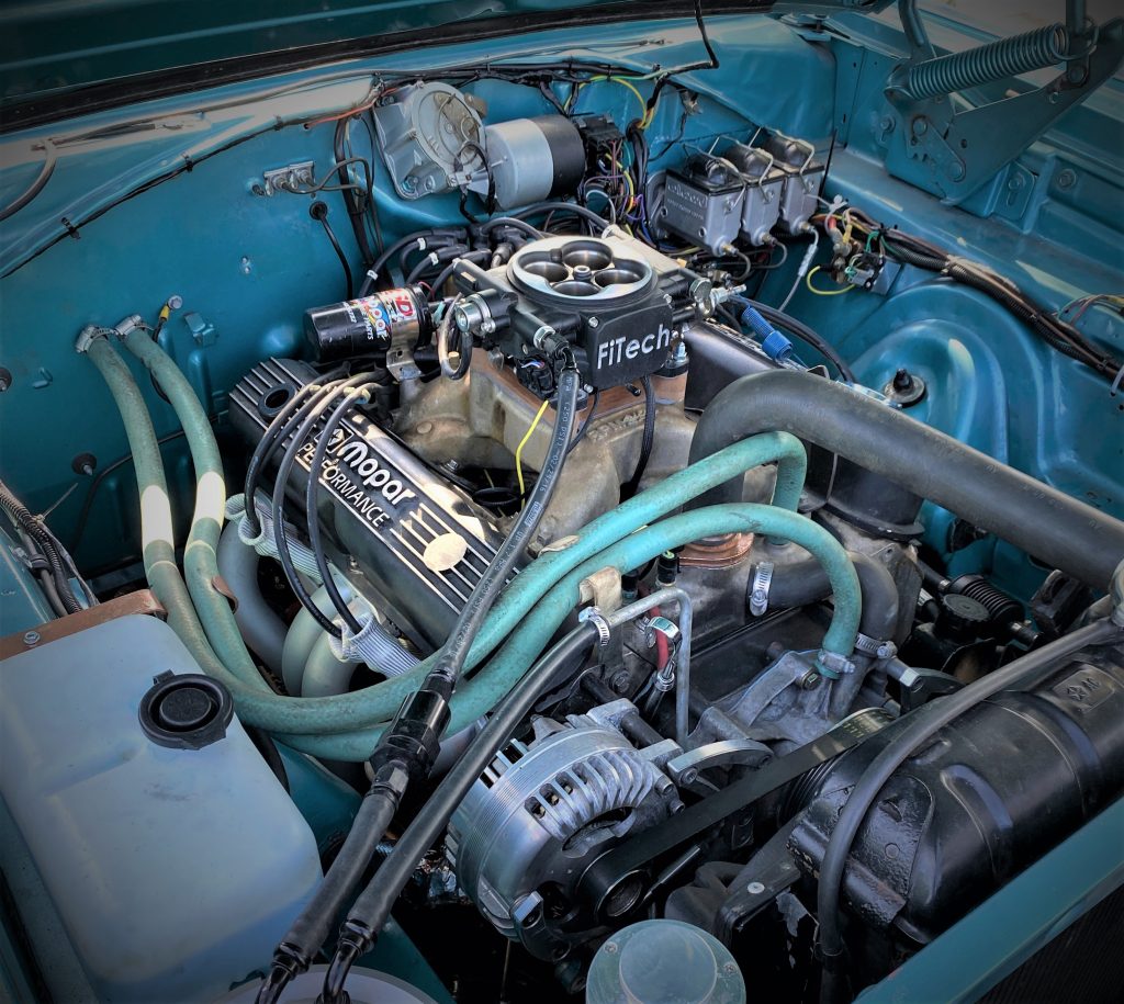 small block mopar v8 engine bay of a 1966 dodge charger