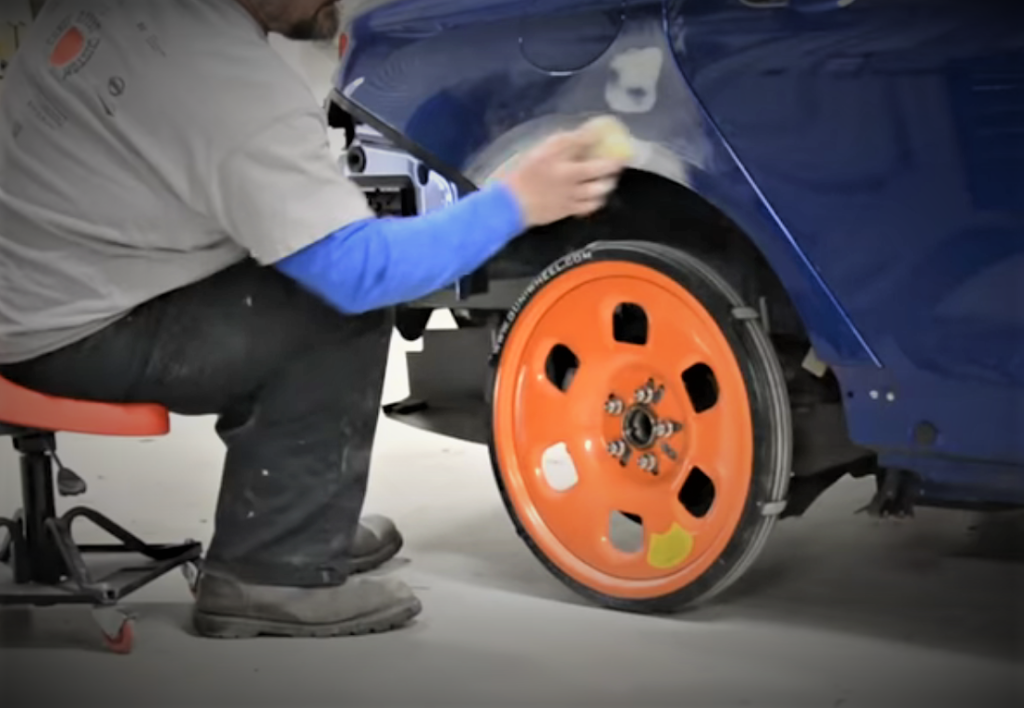 guniwheel in shop on car during fender repair