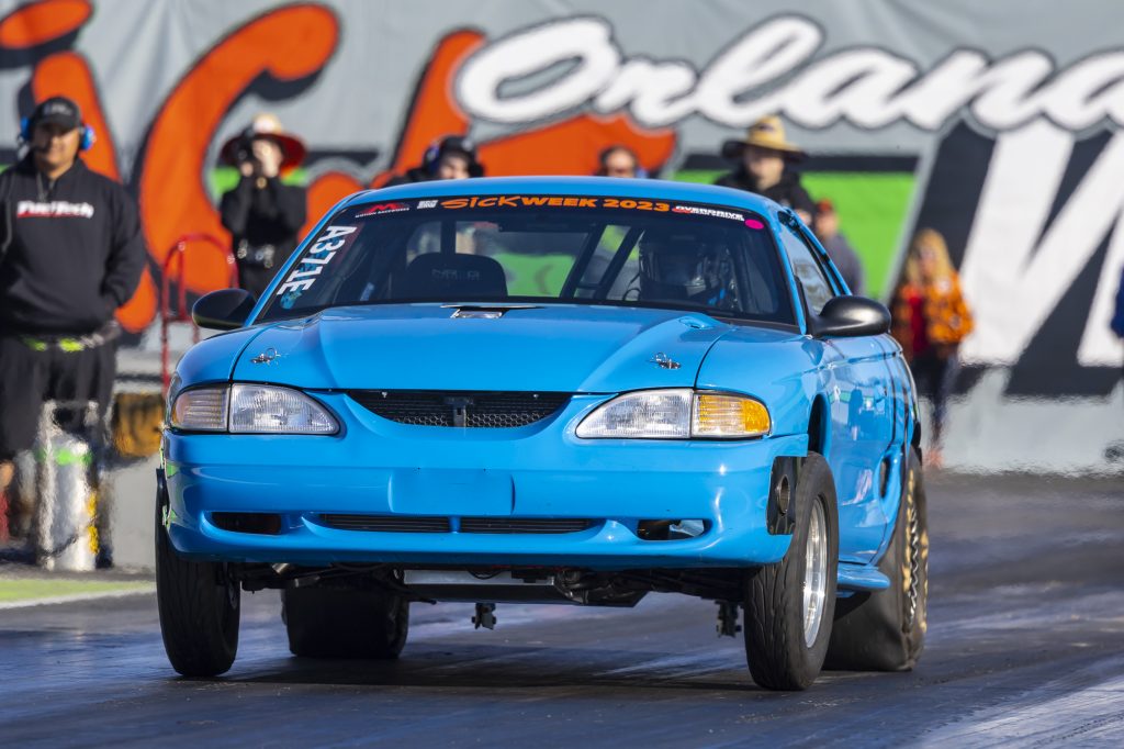 snp5 ford mustang launching at dragstrip during a race