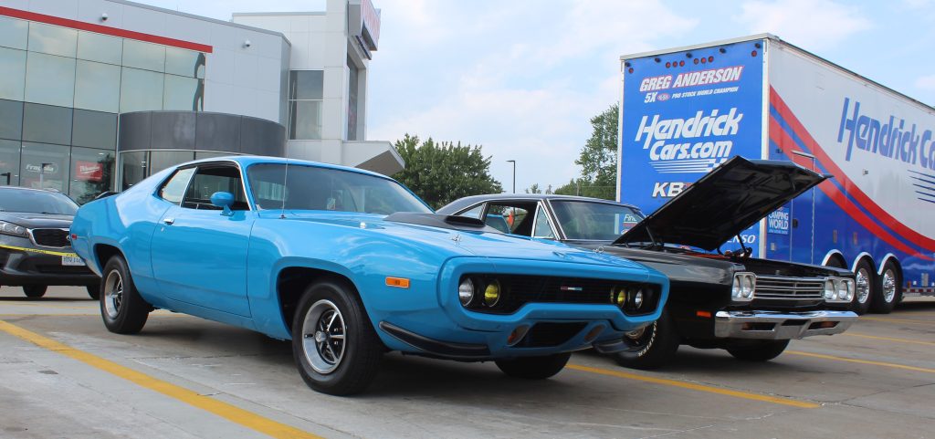 pair of vintage mopar plymouth road runners at summit racing nhra event