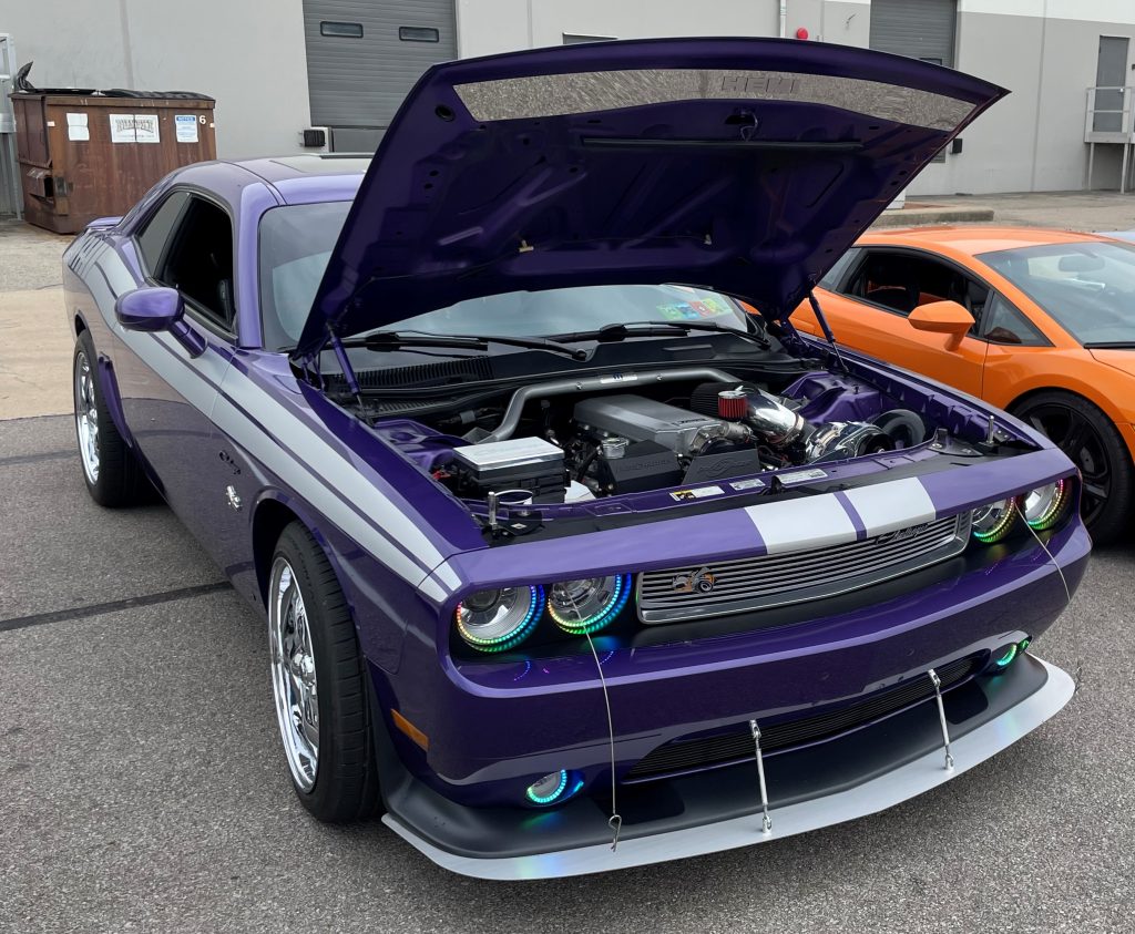 purple late model dodge challenger with halo headlights