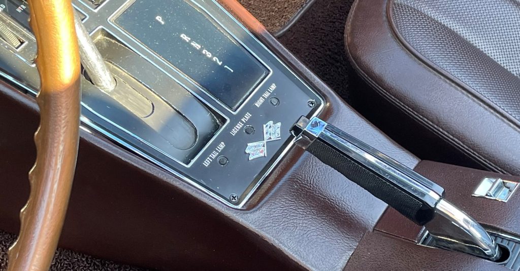 close up of fiber optic indicator lamps on console of a c3 1968 corvette
