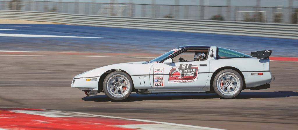 1987 Chevy C4 Corvette racing on an autocross course