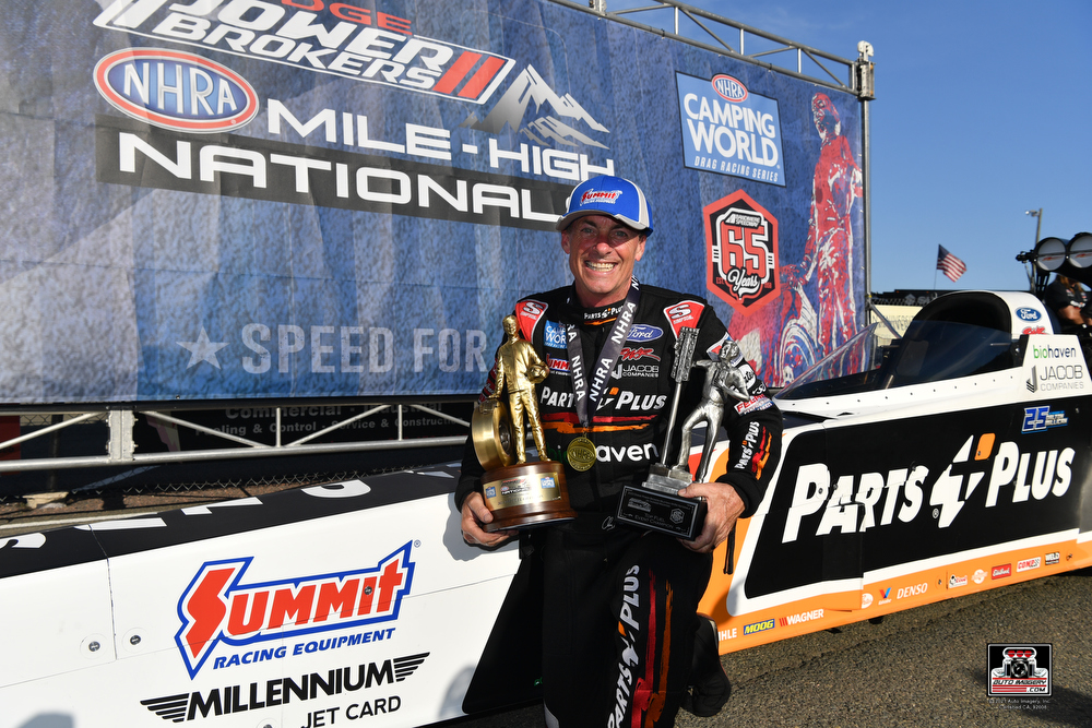 clay millican nhra top fuel driver with wally trophy after thunder mountain nats in bandimere