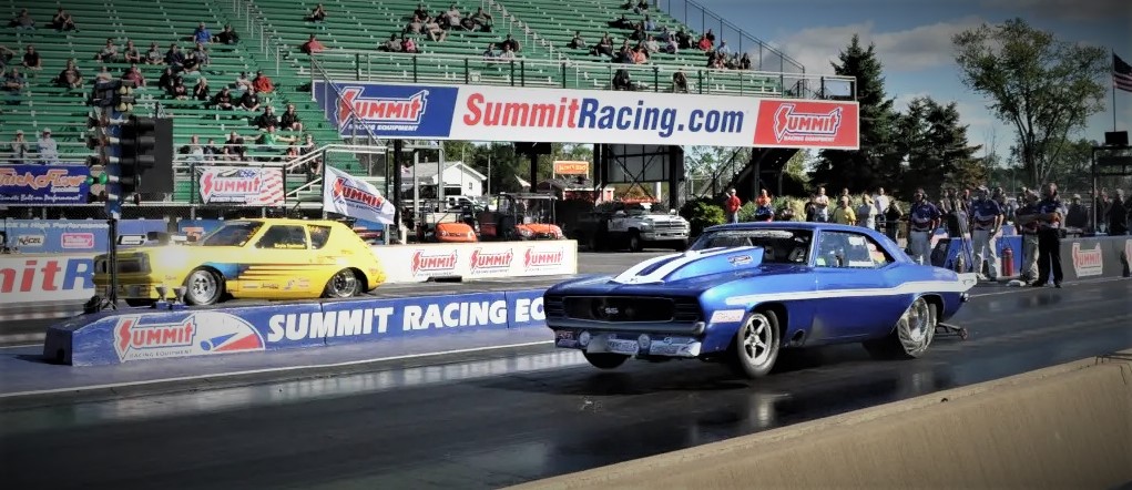 blue Yenko camaro doing a wheel stand at Summit Motorsports park drag race 2