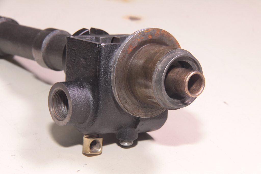 close up of tip of a cast delco distributor body