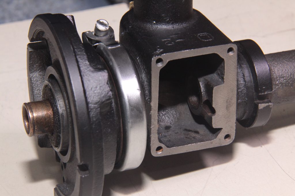 close up of gm delco distributor head and clamp