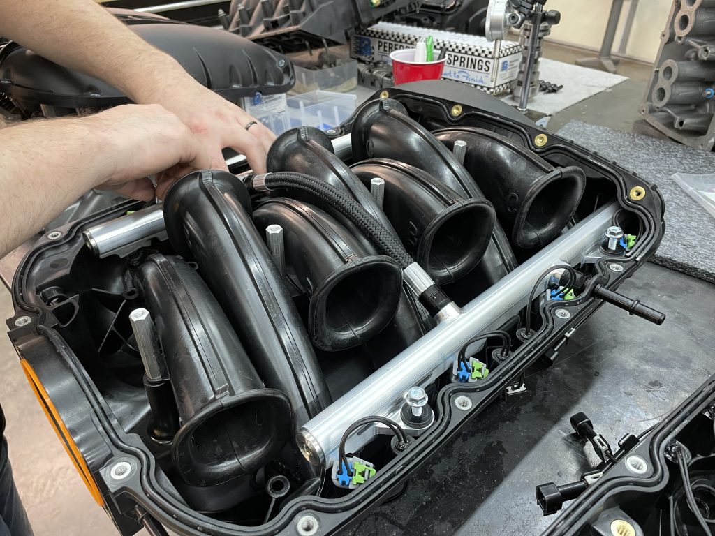 Installing fuel injector rail and lines on an ls engine intake manifold