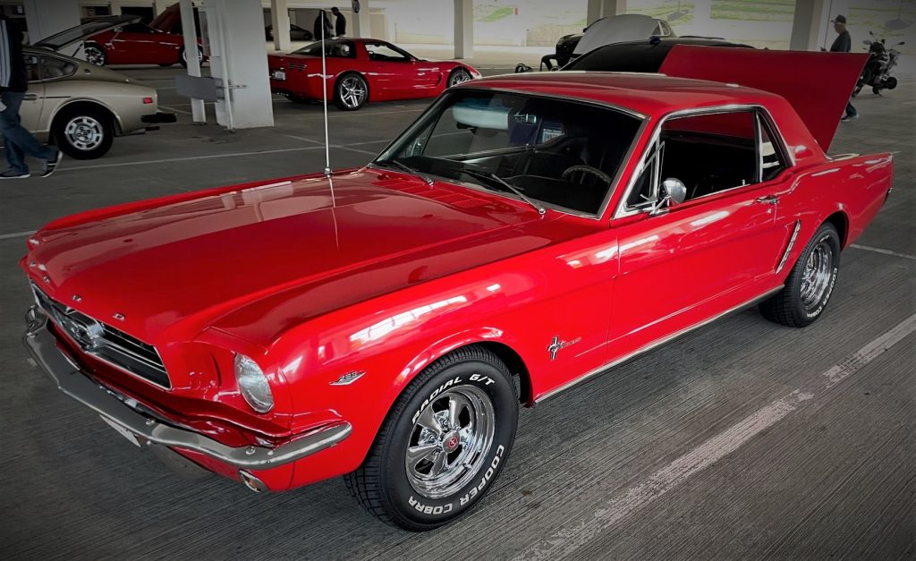 red vintage ford mustang 289 at car show