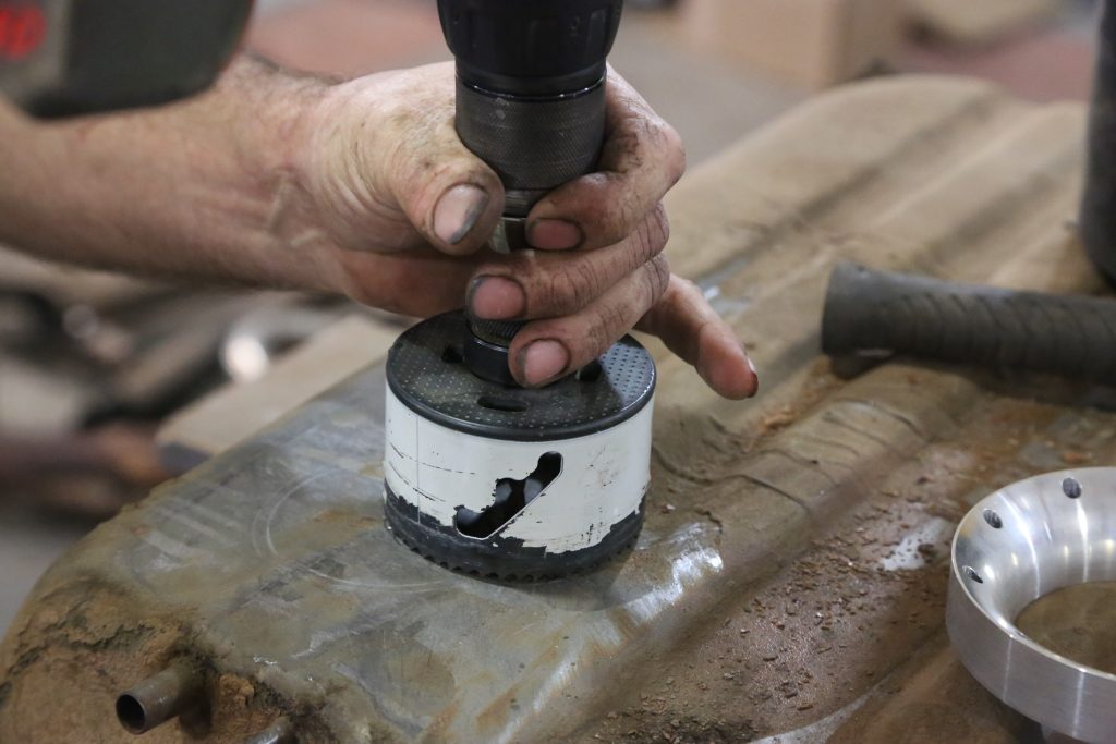 metal hole saw cutting fuel tank for pump retrofit