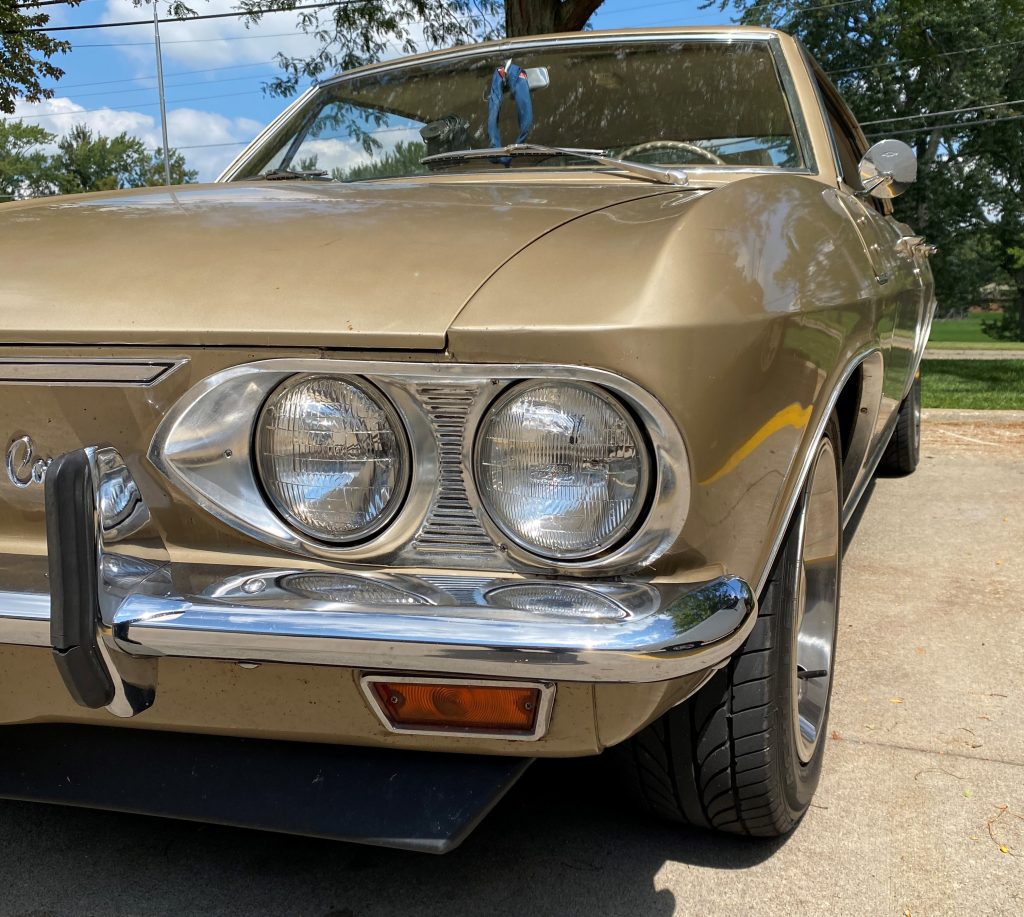 close up of headlight on a 1966 chevy corvair sedan