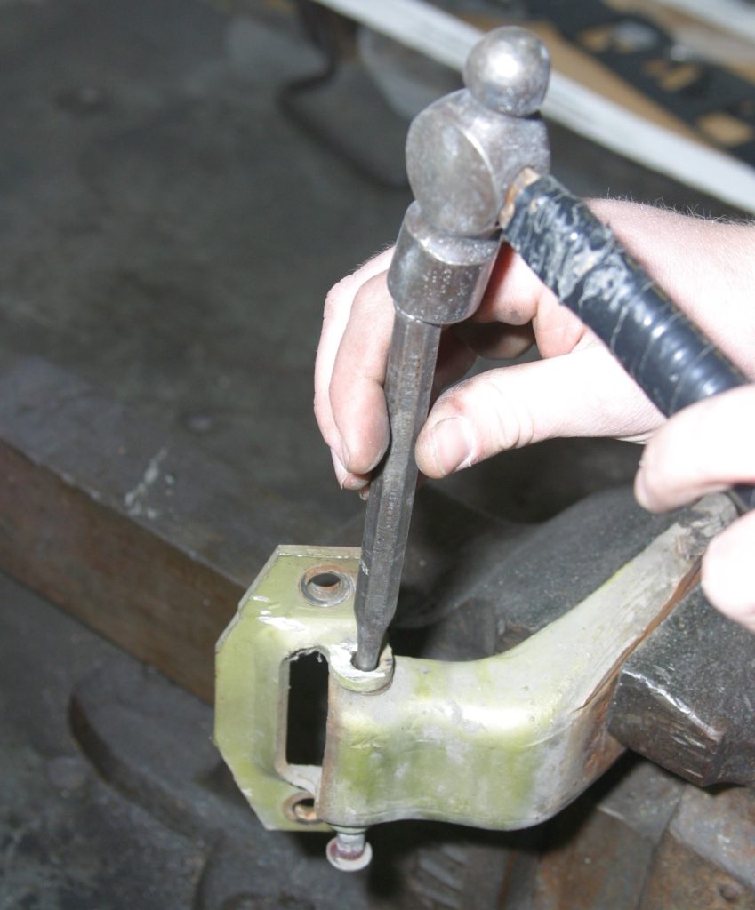 using a drift to hammer out a car door hinge pin
