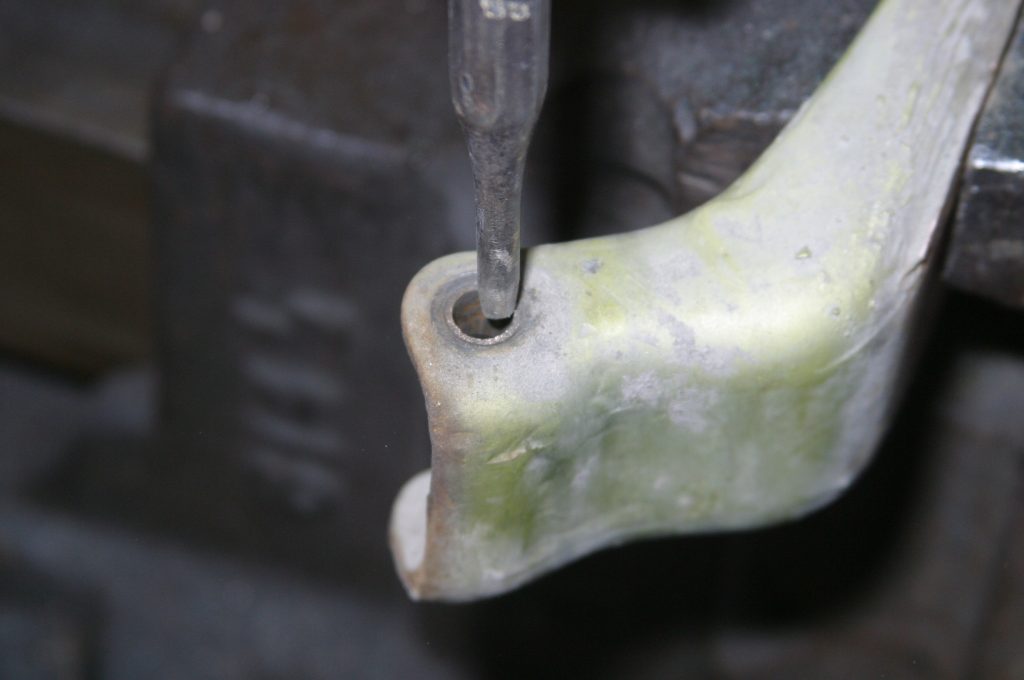close up of door hinge with pin removed