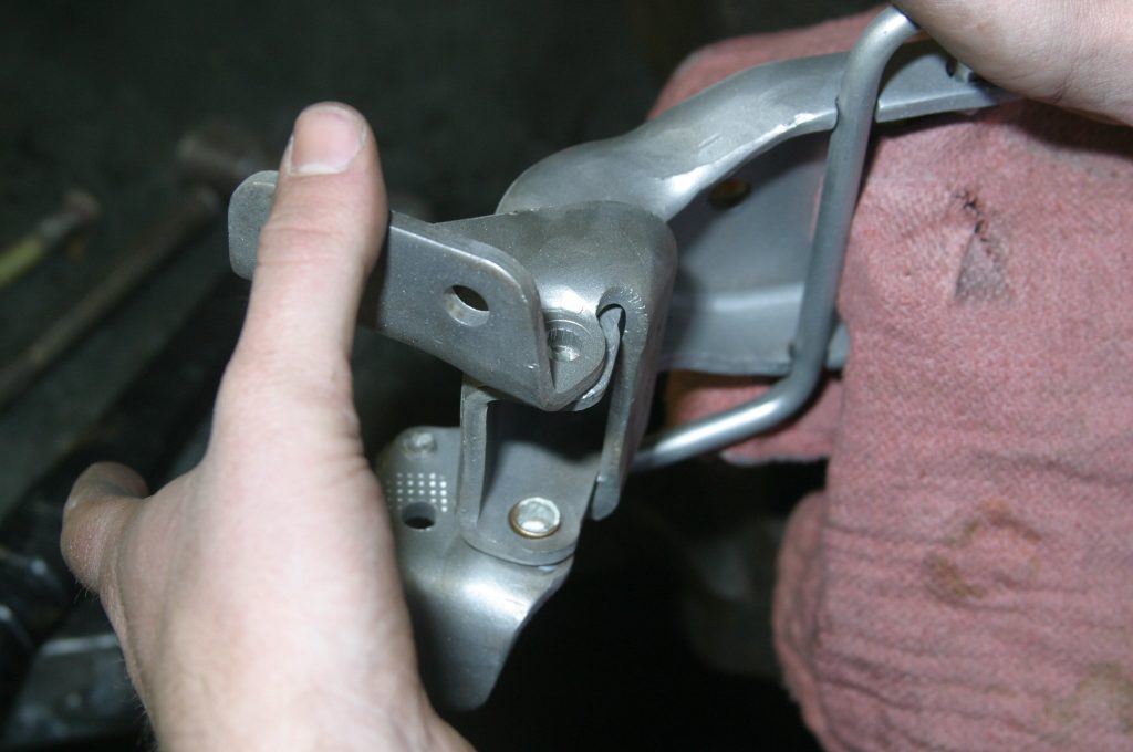 lining up a car door hinge with pin