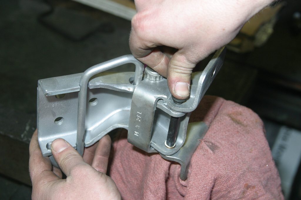 inserting a new pin into a car door hinge