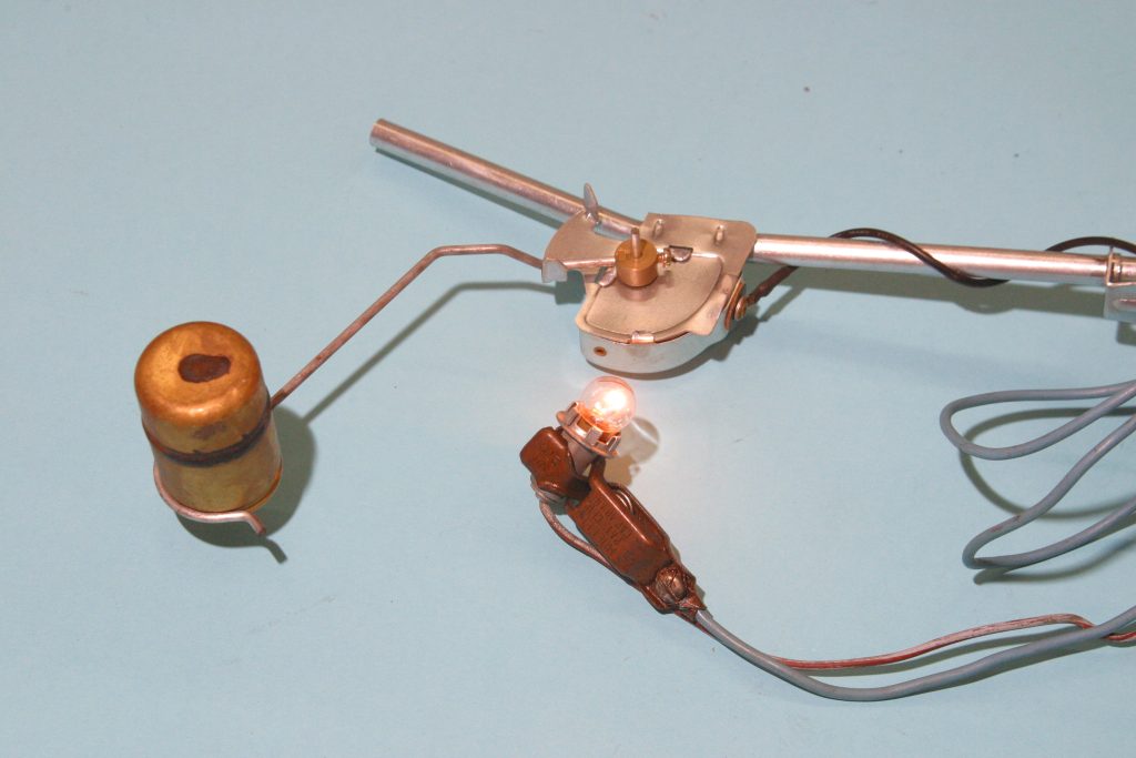 vintage fuel tank level gauge sending unit with light