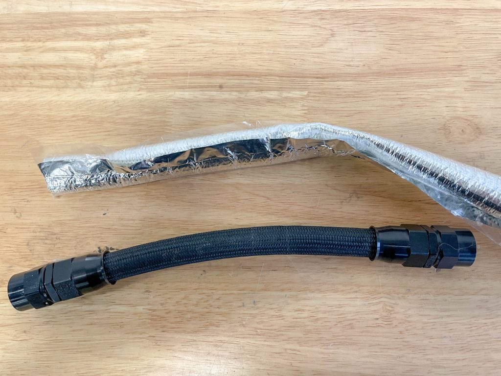 heat shield wrap next to a piece of automotive hose